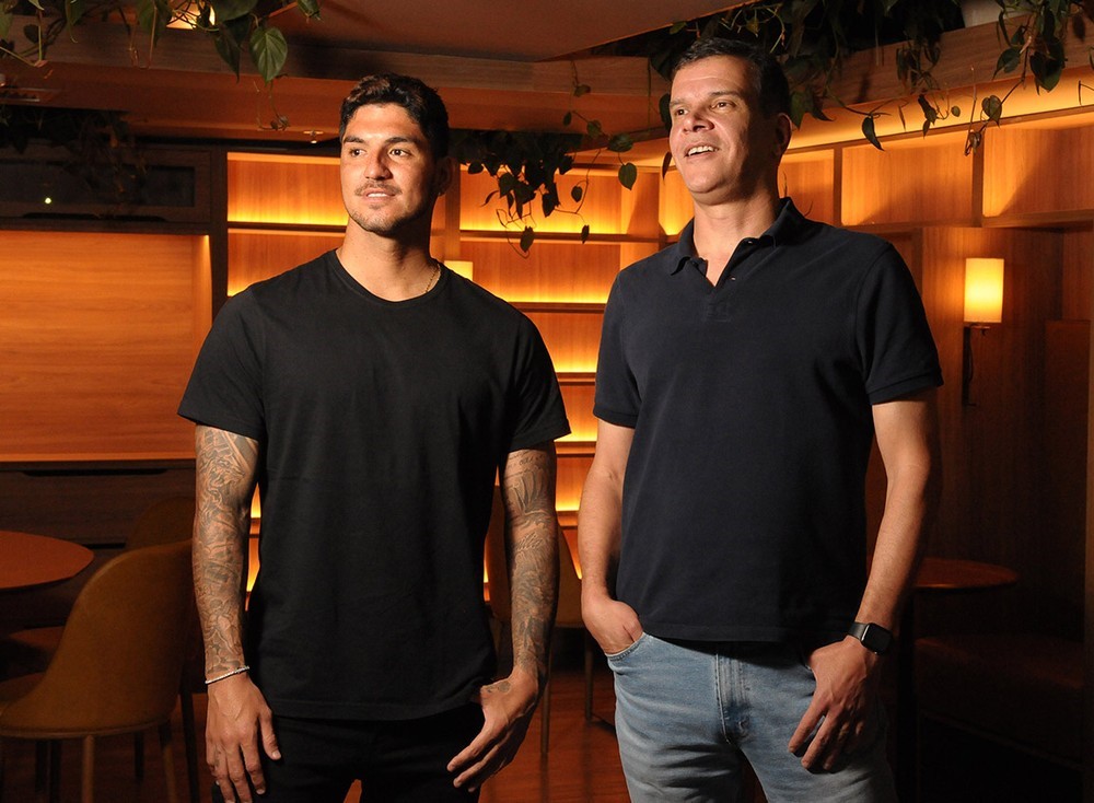 photo of two people: Professional Surfer Gabriel Medina and Ricardo Siqueira of Kauai Ventures